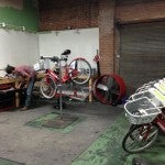 Man fixing a bike share bike