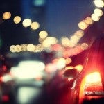 Car sitting in traffic at dusk