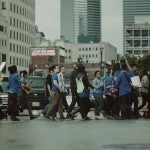 Student protesters walk through the street
