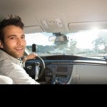 Uber driver smiling to the backseat 