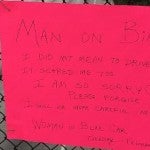 Sign apologizing for driving too close to a biker