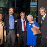 Five people smiling together