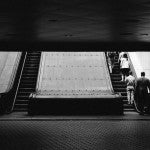 People boarding a escalator