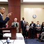 Former President Barack Obama speaking to a group of people
