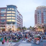 People crowd in a shopping center