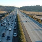 Traffic on one side of the freeway with the other clear