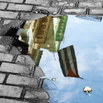 The sky reflecting off a street puddle