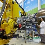 Man works with a robot