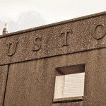 Houston carved out of stone building