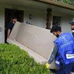 Men moving a couch