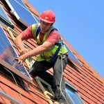 Man installing solar panels