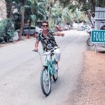 A man on a bicycle is following that dream