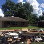 Pile of debris in front of Independence Heights home affected by Hurricane Harvey