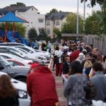 Long lines for the start of early voting snaked around the parking at the Metropolitan Multi-Service Center near downtown Houston on Monday, Oct. 22, 2018.  Michael Stravato for The Texas Tribune