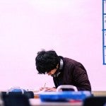 Student in classroom Kinder Institute post