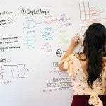 young woman in computer science class