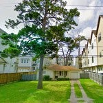 A single-family house sits among town houses on Beall Street in Houston