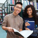 Image of two people in a library