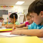 Kids working in class