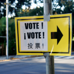 Vote sign with three languages