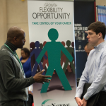 Discussing job opportunities at career fair