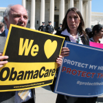 People in support of the ACA at a health care rally 2012