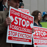 Protestors at a rally demanding accountability from Wall Street