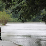 Sheriff officer checking out flood waters