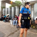 Austin police officers speak to people