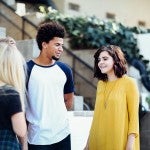 Young, diverse people talking