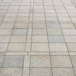 person walks alone in a plaza