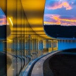 Building reflecting sunset