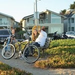 Man and woman on bench by bikes