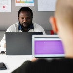 men working on computers