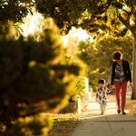 Woman walking with a child