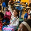 Image of students raising their hands