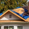 photo of a house undergoing roof repair
