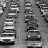 Vintage cars sitting in traffic