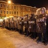 Police standing with shields 