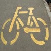 Bike sign spray painted on the pavement 