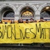 Photo of young people holding a "Black Lives Matter" sign Photo of young people holding a "Black Lives Matter" sign