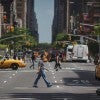 Man crossing the street with taxis in the background