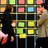 Professional people speaking over post-it notes