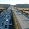 Traffic on one side of the freeway with the other clear Traffic on one side of the freeway with the other clear