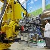 Man works with a robot Man works with a robot