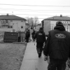 Black and white photo of men and a moving truck