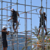 Men working on scaffolding Men working on scaffolding