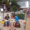 Participants interact with the Parking Day booths