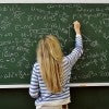 Girl doing math on chalkboard Girl doing math on chalkboard