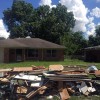 Pile of debris in front of Independence Heights home affected by Hurricane Harvey